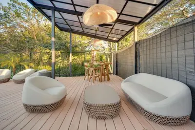 a patio with two white chairs and a table at The Bungalows #8 - Boutique Hotel in Flamingo Beach - Top Level Studio in Playa Flamingo