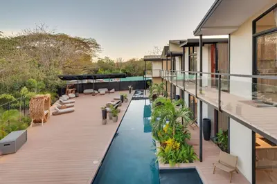 an image of a house with a swimming pool at The Bungalows #9 - Boutique Hotel in Flamingo Beach - Ground Level Studio in Playa Flamingo