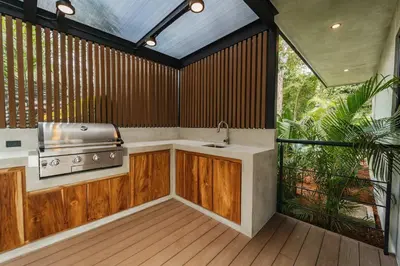 a kitchen with a stove and a grill at Manuel Antonio Tree House Villas - 4 Bedrooms in Quepos