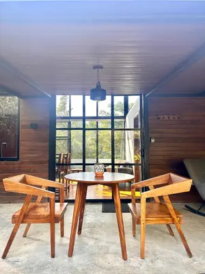 a dining room with a table and two chairs at NATURAVE HOME - Tiny house with mountain view in Monteverde Costa Rica