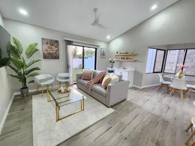 a living room with a couch and a table at Beautiful and cozy home in Alajuela City