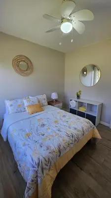a bedroom with a bed and a ceiling fan at Beautiful and cozy home in Alajuela City