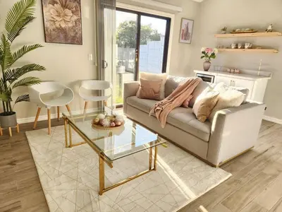 a living room with a couch and a table at Beautiful and cozy home in Alajuela City