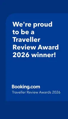 a blue sign that says were proud to be a traveller review award winner at Beautiful and cozy home in Alajuela City