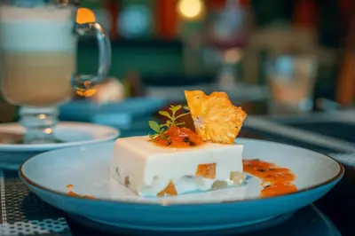 a piece of food on a plate on a table at Lake Arenal Hotel, Brewery & Farm in Tilarán
