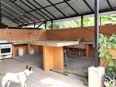 a dog standing next to a table in a building at Casa Canadiense in Chacarita