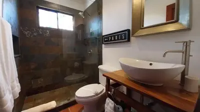 a bathroom with a sink and a toilet and a shower at Villa Estrellas - Stunning Ocean-Views, Potrero, spacious 4 BR Villa in Potrero