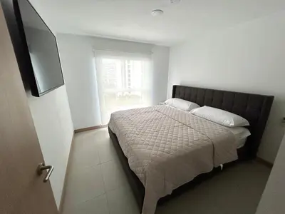 a bedroom with a bed and a television in it at 0905 Viva Jaco in Jacó
