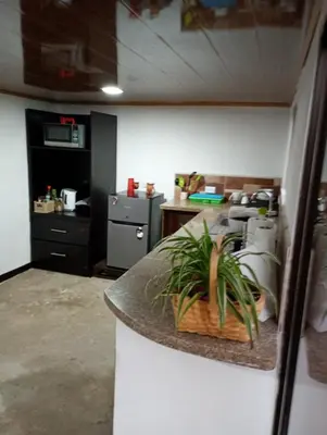 a kitchen with a counter with a plant on it at Marcana Occidente in San Ramón