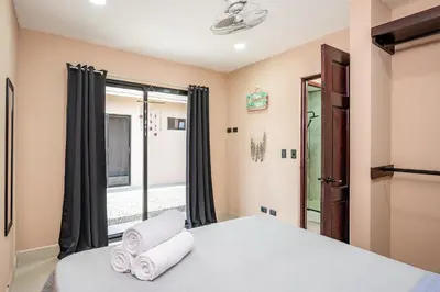a bedroom with a bed and a window at Casa Cerca de Tamarindo,ConchalFlamingo,Potrero,Playa Grande,Avellanas,Langosta in Huacas