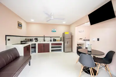 a kitchen and living room with a couch and a table at Casa Cerca de Tamarindo,ConchalFlamingo,Potrero,Playa Grande,Avellanas,Langosta in Huacas