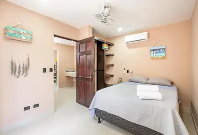 a bedroom with a bed and a bathroom at Casa Cerca de Tamarindo,ConchalFlamingo,Potrero,Playa Grande,Avellanas,Langosta in Huacas