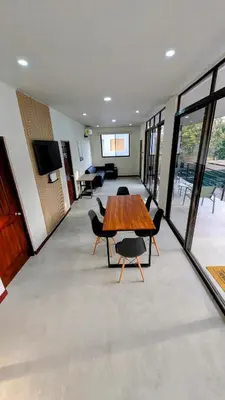 a conference room with a wooden table and chairs at Los Mangos Nosara in Nosara
