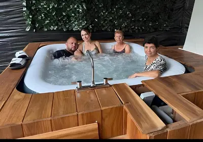 a group of people in a jacuzzi in a boat at ROQUI Cozy Beachfront Cabin in Uvita