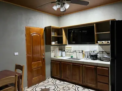 a kitchen with a sink and a counter top at Apartamento Lulú in Uvita