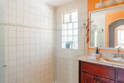 a bathroom with a sink and a mirror at Altavista #3 in Jacó