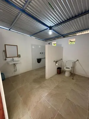 a bathroom with a toilet and a sink at Camping Finca Planeta Sano in Naranjito