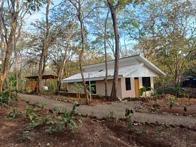 a small white house in the woods at New casita walking distance to Avellanas beach in Río Sequito