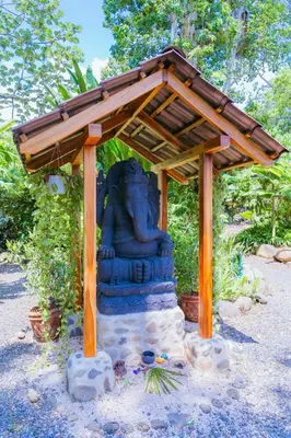 a statue with a roof on top of it at Awake Uvita in Uvita
