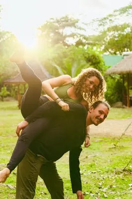 a man carrying a woman on his back at Awake Uvita in Uvita