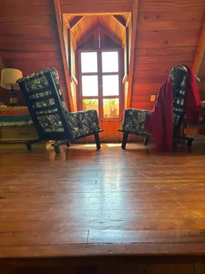 two chairs sitting in a room with a window at Mountain Chalet with Valley View in Alajuela City