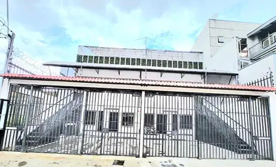 a building with a gate in front of it at Apartamentos Cabo Verde B1 in Uruca