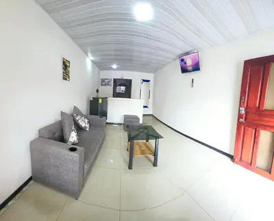 a living room with a couch and a table at Apartamentos Cabo Verde B1 in Uruca