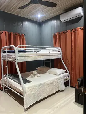 a bunk bed room with two bunk beds in it at Casa Briana in Uvita