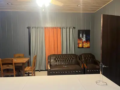 a living room with a couch and a table at Casa Briana in Uvita
