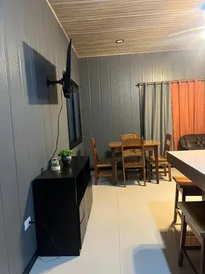 a kitchen and dining room with a table and chairs at Casa Briana in Uvita