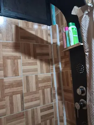 a shower door with at Casa Lilly in Pejibaye