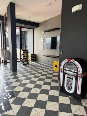 a room with a checkerboard floor with a suitcase at Great View in Escalante! in San José