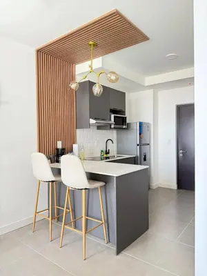 a kitchen with a counter and two stools in it at Great View in Escalante! in San José