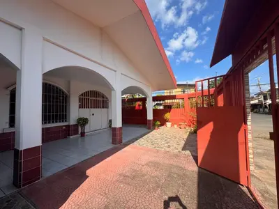 an outside view of a building with red and white at Hostel la perla in Puntarenas