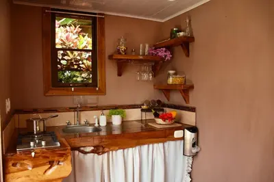 a kitchen with a sink and a window at Natural - cabin, 30 min Fortuna, wifi 200mb in San Pedro