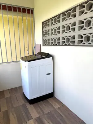 a small white trash can in a room at Casa De Daniel in Daniel Flores