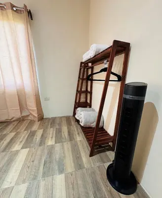 a room with a bunk bed and a trash can at Casa De Daniel in Daniel Flores