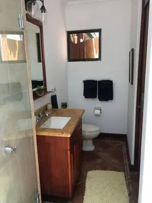 a bathroom with a sink and a toilet at Playa Grande, Las Baulas National Park BnB in Playa Grande