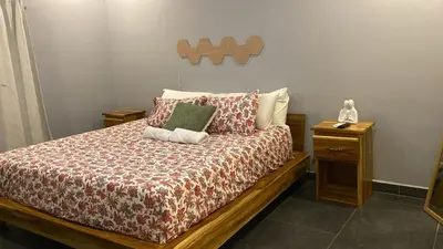 a bedroom with a large bed with at Villa Paradise in Guatemala