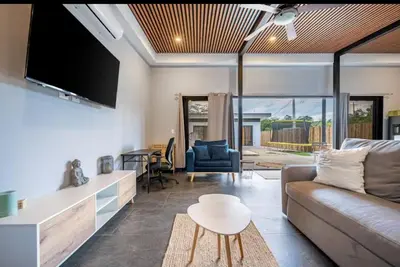 a living room with a couch and a table at Villa Paradise in Guatemala