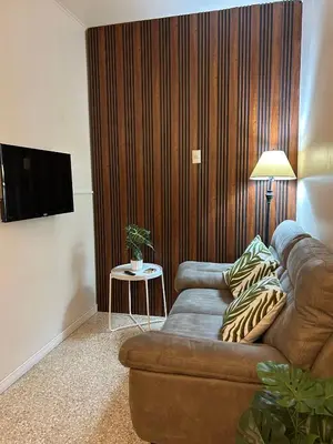 a living room with a couch and a table at Vargas Lodge, Costa Rica in San Vicente