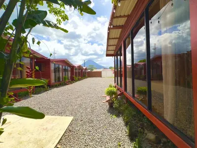 a walkway next to a building with plants on it at Tribu Bungalow 1 Modern and Centrally Located in Fortuna