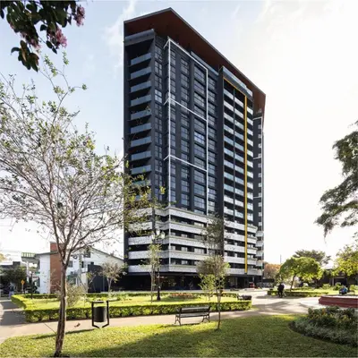 a tall building with a park in front of it at Apartamento en Barrio Escalante in San José