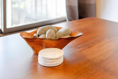 a bowl of rocks sitting on top of a table at Casa Fe- Newly Renovated 2 bedroom condo in Ocotal