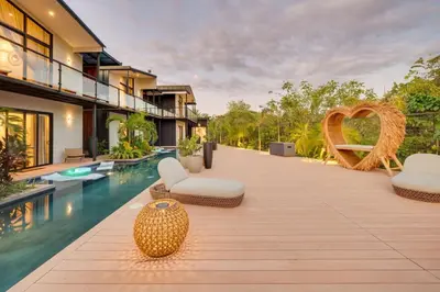 an exterior view of a villa with a swimming pool at The Bungalows #10 - Boutique Hotel in Flamingo Beach - Top Level Studio in Playa Flamingo