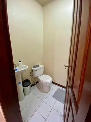 a bathroom with a toilet and a sink at Casa Amura in Liberia