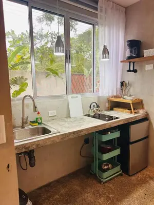 a kitchen with a sink and a counter top at Villa Carol in Punta Leona
