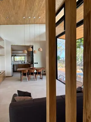 a living room with a couch and a table at Mar a Cielo Brand New Ocean View Retreat in Mal País