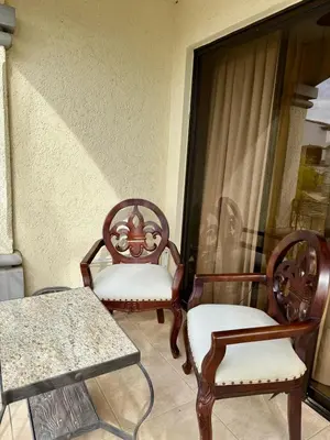 two chairs and a table on a balcony at Relaxing 1BR Oasis near Tamarindo in Villarreal