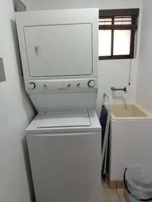 a white refrigerator in a bathroom with a sink at Relaxing 1BR Oasis near Tamarindo in Villarreal